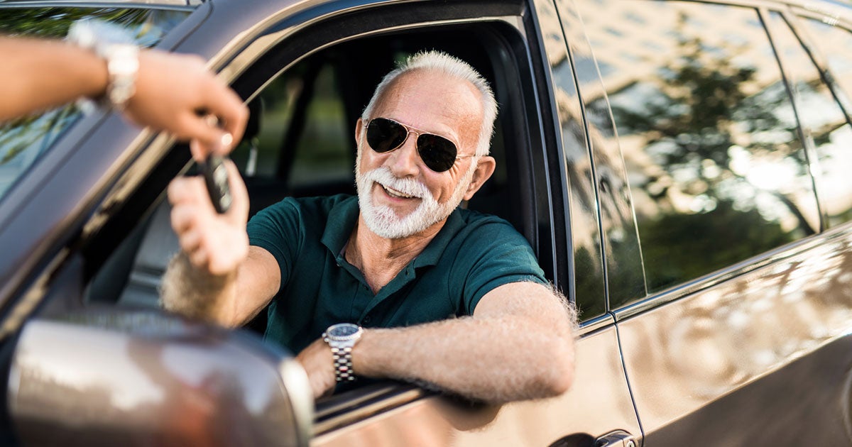 older man in car